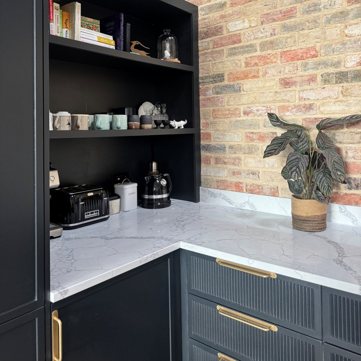 Top view of a slimline shaker cabinet with various items including books and decorative objects.