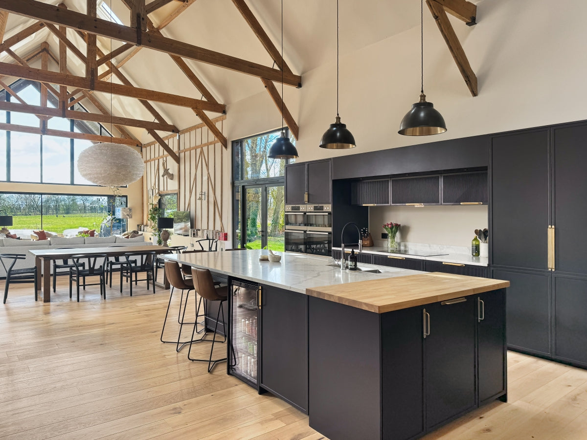 Modern kitchen with shaker reeded kitchen island and slimline shaker cabinets in a well-lit room.