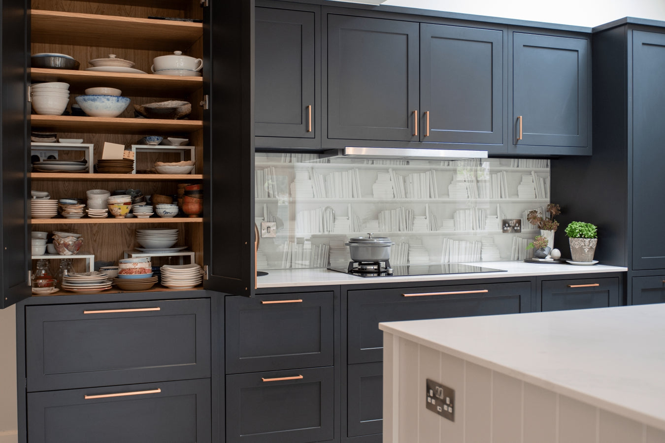 Inframe shaker kitchen cabinet white countertops, and a tiled backsplash.