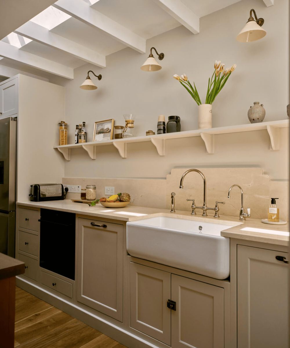 In-frame kitchen with farmhouse sink and shaker cabinetry